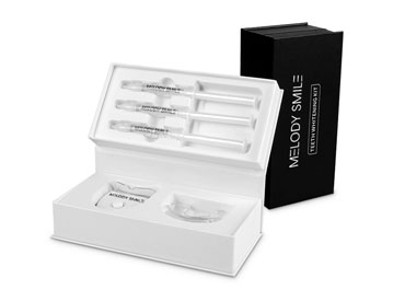 Teeth whitening kit with syringes and mouth tray, sleek white packaging